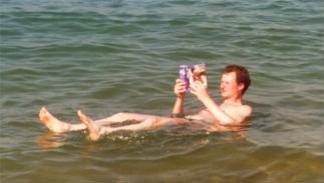 The inevitable photo: Reading while floating in the Dead Sea