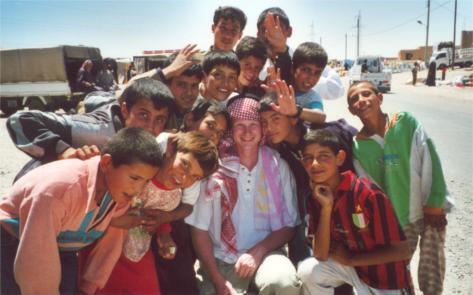 Me with lots of enthusiastic children on a market in Syria